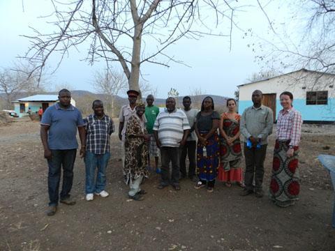Chief Nyalugwe’s Palace, Paramount Chief for Nyimba District [includes team members Gift Sikaundi (2nd from left), Sylvester Siame (2nd from right), and LaWen Hollingsworth (right), in addition to Catherine Tembo from USAID (4th from right), village leaders, and Chief Nyalugwe (left center in traditional leopard garb)] Photo by Darren Johnson / U.S. Forest Service.